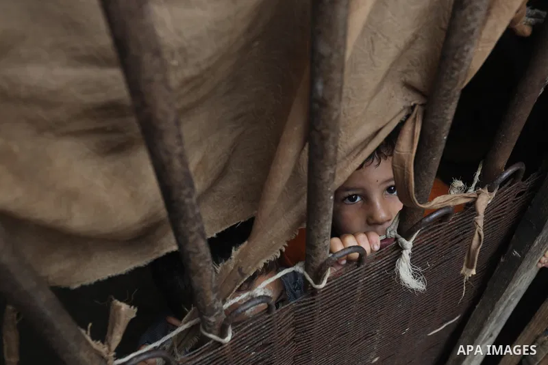 Palestinians show as they in their daily lives during a rainy day, in Deir al-Balah in the center of Gaza strip on November 21, 2021. The effects of the low pressure front which affected Palestine yesterday are expected...