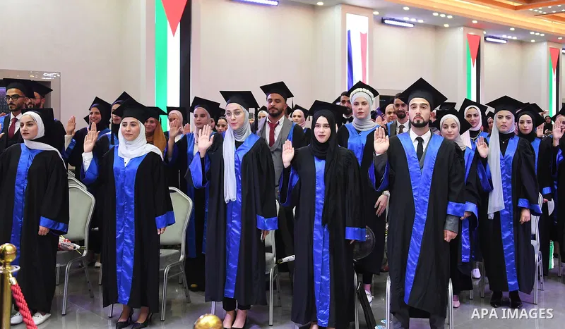 Palestinian Prime Minister Mohammed Ishtayeh participates in the graduation ceremony of the first cohort of Nablus University for Vocational and Technical Education, in the West Bank city of Ramallah, on November 21, 202...
