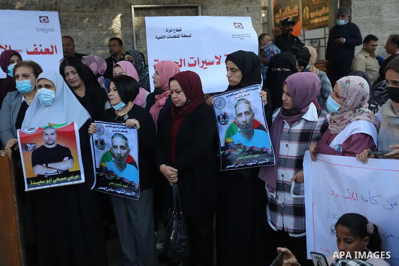 Palestinians take part in a protest against the death of prisoner Sami al-Amour in Israeli Jails as a result of intentional medical negligence, in Red cross office, in Gaza city on November 22, 2021. The al-Amour, 39, fr...