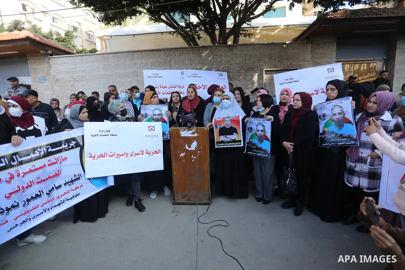 Palestinians take part in a protest against the death of prisoner Sami al-Amour in Israeli Jails as a result of intentional medical negligence, in Red cross office, in Gaza city on November 22, 2021. The al-Amour, 39, fr...
