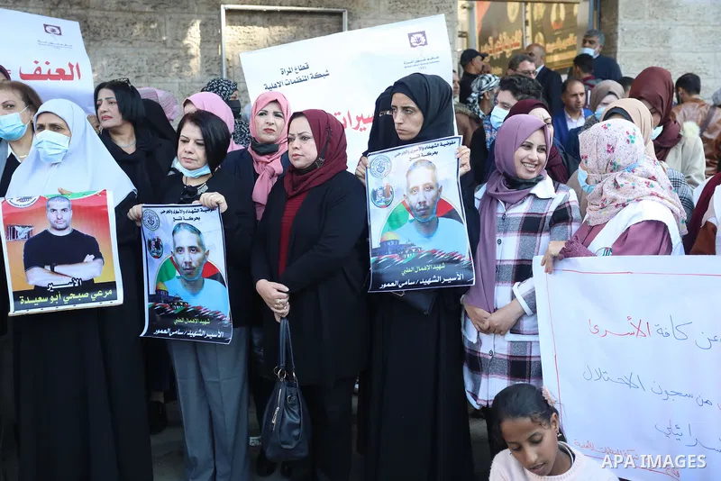 Palestinians take part in a protest against the death of prisoner Sami al-Amour in Israeli Jails as a result of intentional medical negligence, in Red cross office, in Gaza city on November 22, 2021. The al-Amour, 39, fr...