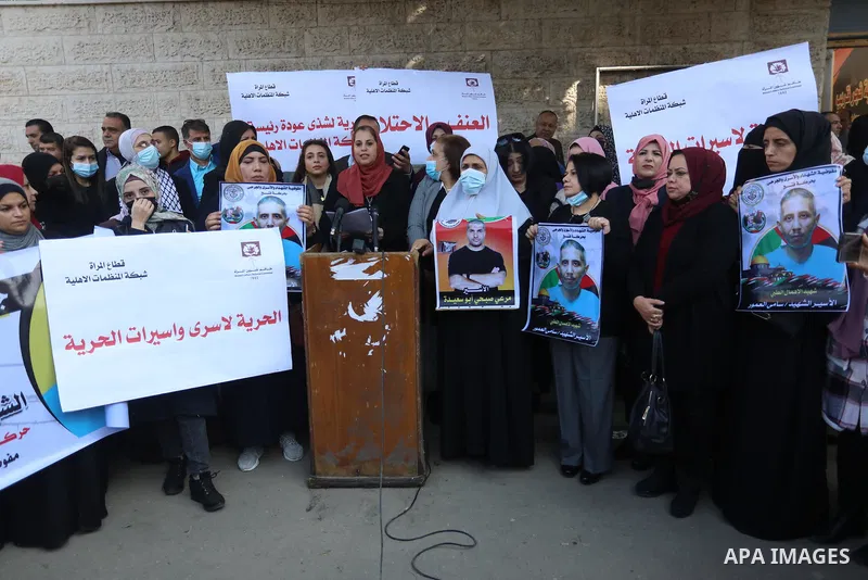 Palestinians take part in a protest against the death of prisoner Sami al-Amour in Israeli Jails as a result of intentional medical negligence, in Red cross office, in Gaza city on November 22, 2021. The al-Amour, 39, fr...