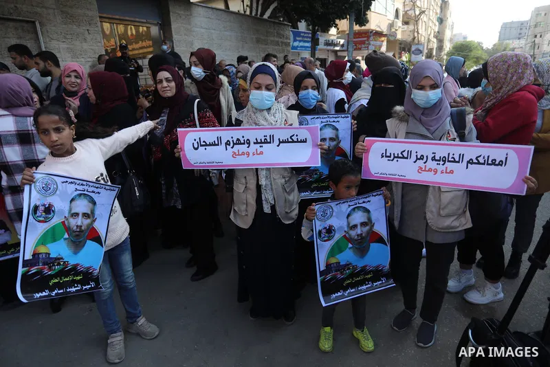 Palestinians take part in a protest against the death of prisoner Sami al-Amour in Israeli Jails as a result of intentional medical negligence, in Red cross office, in Gaza city on November 22, 2021. The al-Amour, 39, fr...