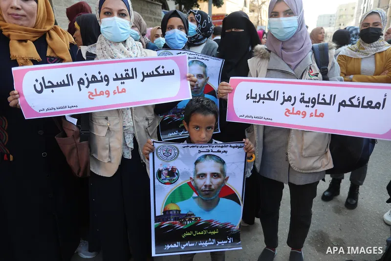 Palestinians take part in a protest against the death of prisoner Sami al-Amour in Israeli Jails as a result of intentional medical negligence, in Red cross office, in Gaza city on November 22, 2021. The al-Amour, 39, fr...