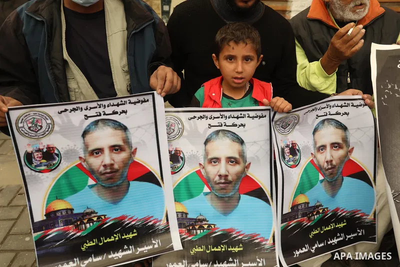 Palestinians take part in a protest against the death of prisoner Sami al-Amour in Israeli Jails as a result of intentional medical negligence, in Red cross office, in Gaza city on November 22, 2021. The al-Amour, 39, fr...