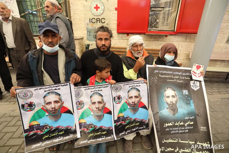 Palestinians take part in a protest against the death of prisoner Sami al-Amour in Israeli Jails as a result of intentional medical negligence, in Red cross office, in Gaza city on November 22, 2021. The al-Amour, 39, fr...