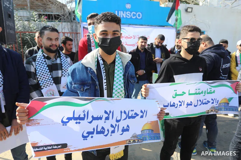Palestinian students take part in a protest against the British Home Secretary Priti Patel decision to ban Hamas in front of the UNESCO headquarters, in Gaza city on November 22, 2021. Hamas has condemned a move by Brita...