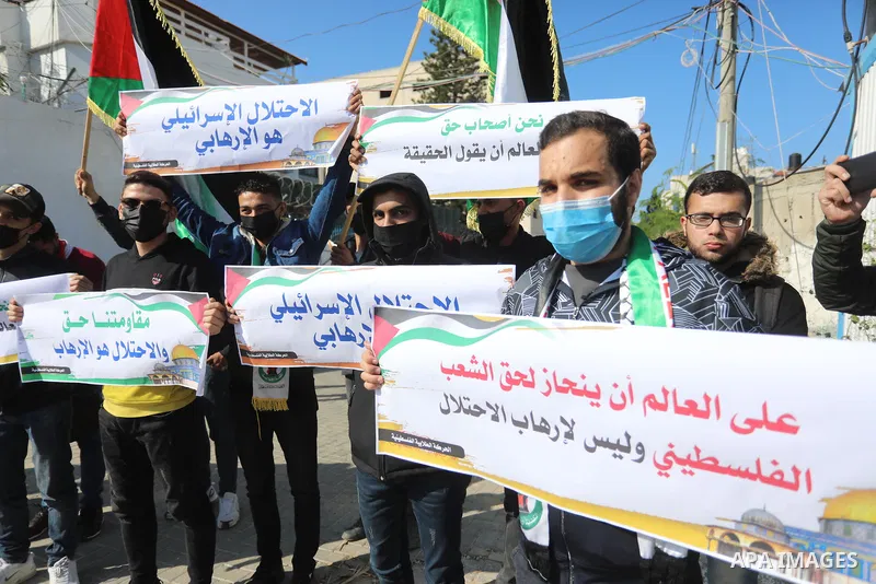 Palestinian students take part in a protest against the British Home Secretary Priti Patel decision to ban Hamas in front of the UNESCO headquarters, in Gaza city on November 22, 2021. Hamas has condemned a move by Brita...