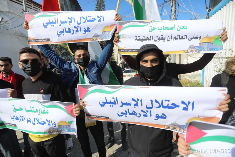 Palestinian students take part in a protest against the British Home Secretary Priti Patel decision to ban Hamas in front of the UNESCO headquarters, in Gaza city on November 22, 2021. Hamas has condemned a move by Brita...