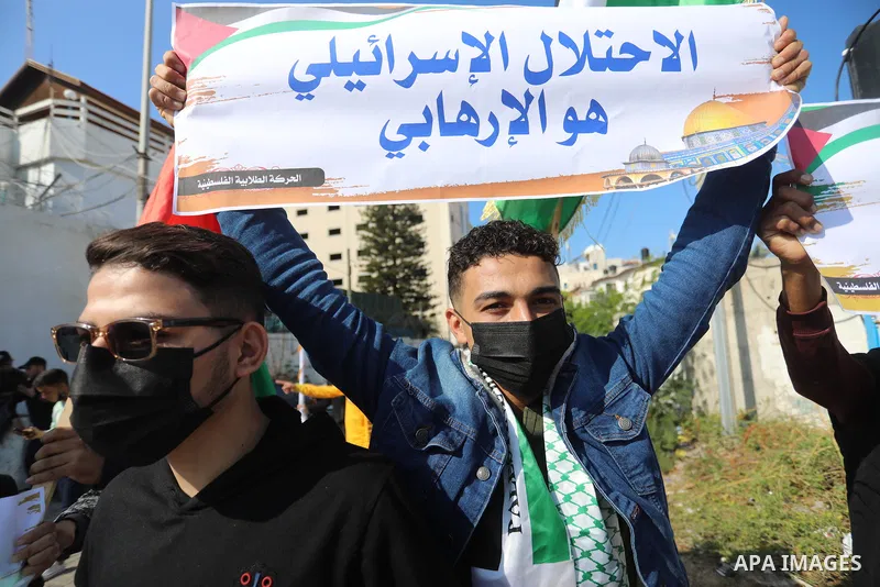 Palestinian students take part in a protest against the British Home Secretary Priti Patel decision to ban Hamas in front of the UNESCO headquarters, in Gaza city on November 22, 2021. Hamas has condemned a move by Brita...