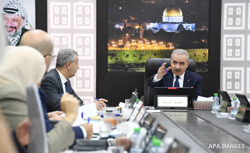 Palestinian Prime Minister Mohammed Ishtayeh chairs the weekly meeting of his government, in the West Bank city of Ramallah on November 22, 2021. Photo by Prime Minister Office