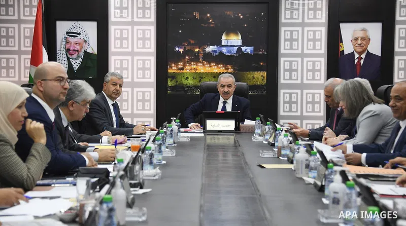 Palestinian Prime Minister Mohammed Ishtayeh chairs the weekly meeting of his government, in the West Bank city of Ramallah on November 22, 2021. Photo by Prime Minister Office
