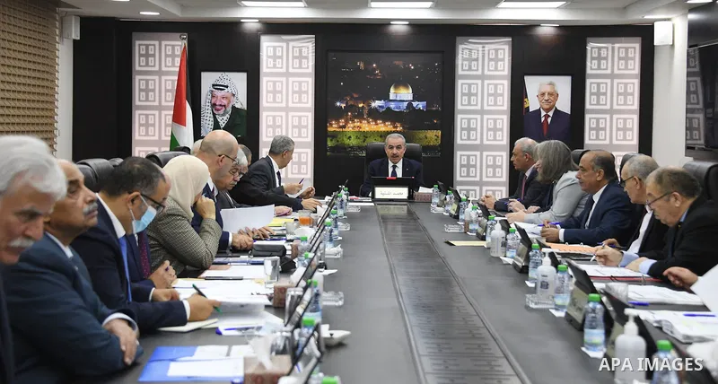 Palestinian Prime Minister Mohammed Ishtayeh chairs the weekly meeting of his government, in the West Bank city of Ramallah on November 22, 2021. Photo by Prime Minister Office