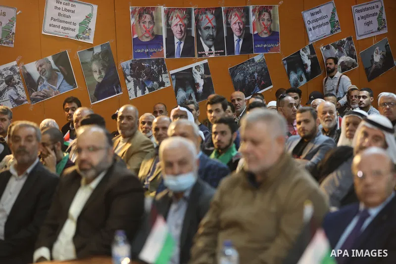 Palestinians take part in a rally against the British Home Secretary Priti Patel decision to ban Hamas, in Gaza City on November 23, 2021. Showing support for Hamas in Britain could be punished with 14 years in prison if...