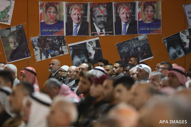 Palestinians take part in a rally against the British Home Secretary Priti Patel decision to ban Hamas, in Gaza City on November 23, 2021. Showing support for Hamas in Britain could be punished with 14 years in prison if...
