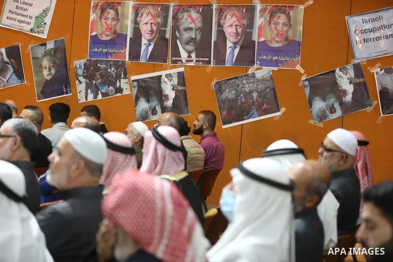 Palestinians take part in a rally against the British Home Secretary Priti Patel decision to ban Hamas, in Gaza City on November 23, 2021. Showing support for Hamas in Britain could be punished with 14 years in prison if...
