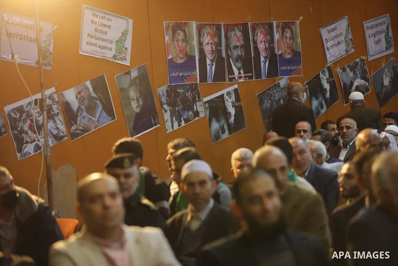 Palestinians take part in a rally against the British Home Secretary Priti Patel decision to ban Hamas, in Gaza City on November 23, 2021. Showing support for Hamas in Britain could be punished with 14 years in prison if...