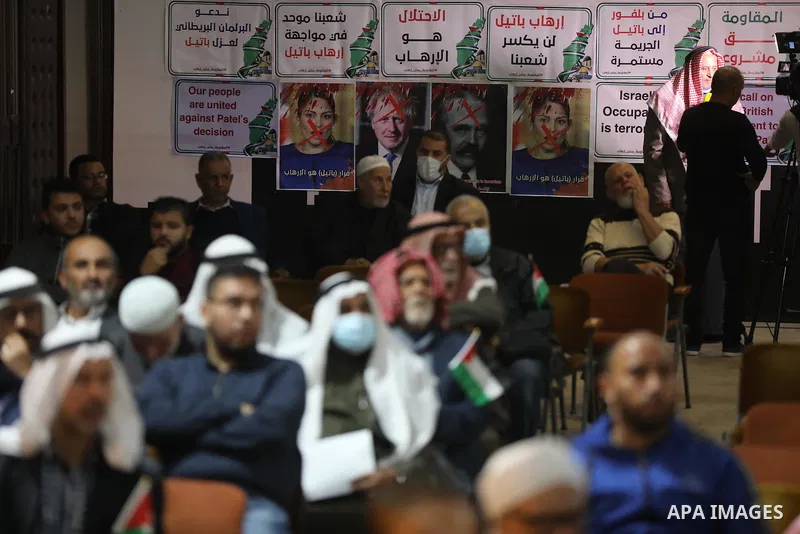 Palestinians take part in a rally against the British Home Secretary Priti Patel decision to ban Hamas, in Gaza City on November 23, 2021. Showing support for Hamas in Britain could be punished with 14 years in prison if...