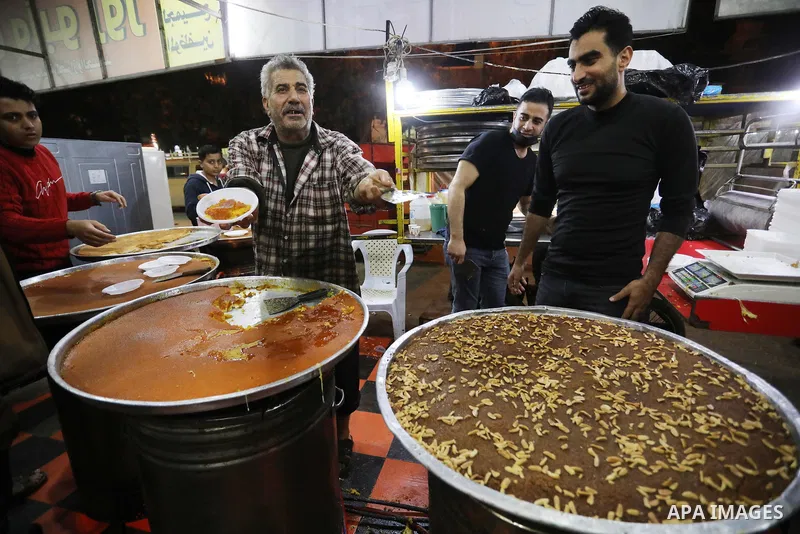 Masoud Al-Qatati, a Palestinian man sells sweets low prices and sometimes free for customers due to the difficult economic conditions of the residents of the Gaza Strip, in Gaza city on November 23, 2021. Al-Qatati said...