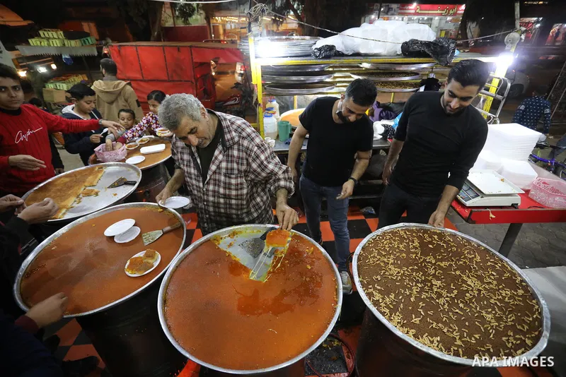 Masoud Al-Qatati, a Palestinian man sells sweets low prices and sometimes free for customers due to the difficult economic conditions of the residents of the Gaza Strip, in Gaza city on November 23, 2021. Al-Qatati said...