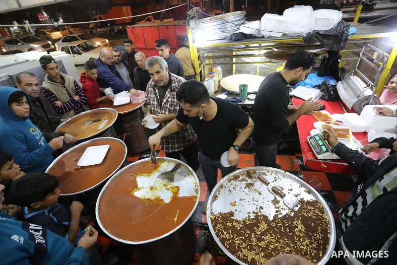 Masoud Al-Qatati, a Palestinian man sells sweets low prices and sometimes free for customers due to the difficult economic conditions of the residents of the Gaza Strip, in Gaza city on November 23, 2021. Al-Qatati said...