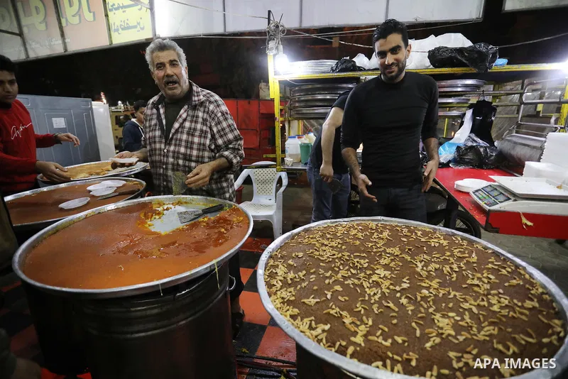 Masoud Al-Qatati, a Palestinian man sells sweets low prices and sometimes free for customers due to the difficult economic conditions of the residents of the Gaza Strip, in Gaza city on November 23, 2021. Al-Qatati said...