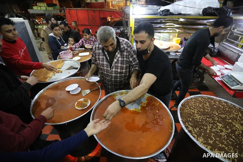 Masoud Al-Qatati, a Palestinian man sells sweets low prices and sometimes free for customers due to the difficult economic conditions of the residents of the Gaza Strip, in Gaza city on November 23, 2021. Al-Qatati said...