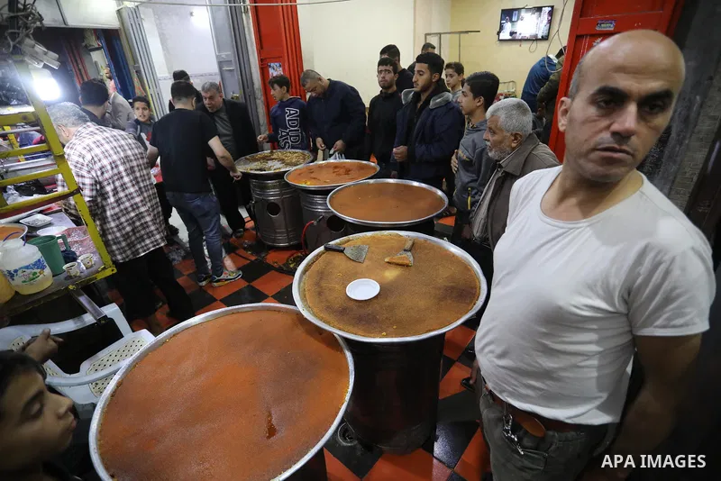 Masoud Al-Qatati, a Palestinian man sells sweets low prices and sometimes free for customers due to the difficult economic conditions of the residents of the Gaza Strip, in Gaza city on November 23, 2021. Al-Qatati said...