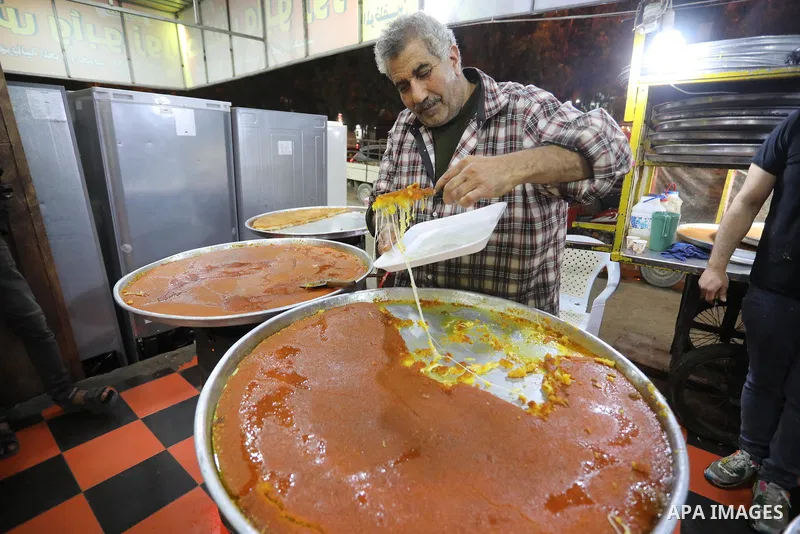 Masoud Al-Qatati, a Palestinian man sells sweets low prices and sometimes free for customers due to the difficult economic conditions of the residents of the Gaza Strip, in Gaza city on November 23, 2021. Al-Qatati said...