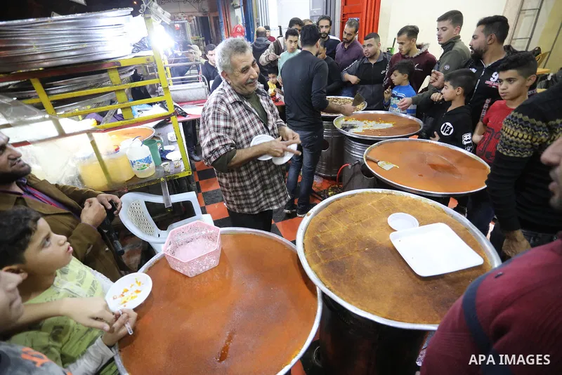 Masoud Al-Qatati, a Palestinian man sells sweets low prices and sometimes free for customers due to the difficult economic conditions of the residents of the Gaza Strip, in Gaza city on November 23, 2021. Al-Qatati said...