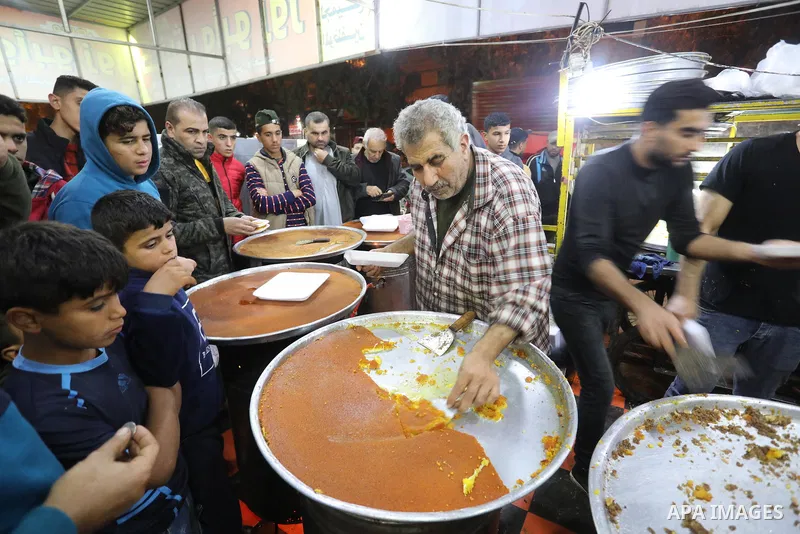 Masoud Al-Qatati, a Palestinian man sells sweets low prices and sometimes free for customers due to the difficult economic conditions of the residents of the Gaza Strip, in Gaza city on November 23, 2021. Al-Qatati said...