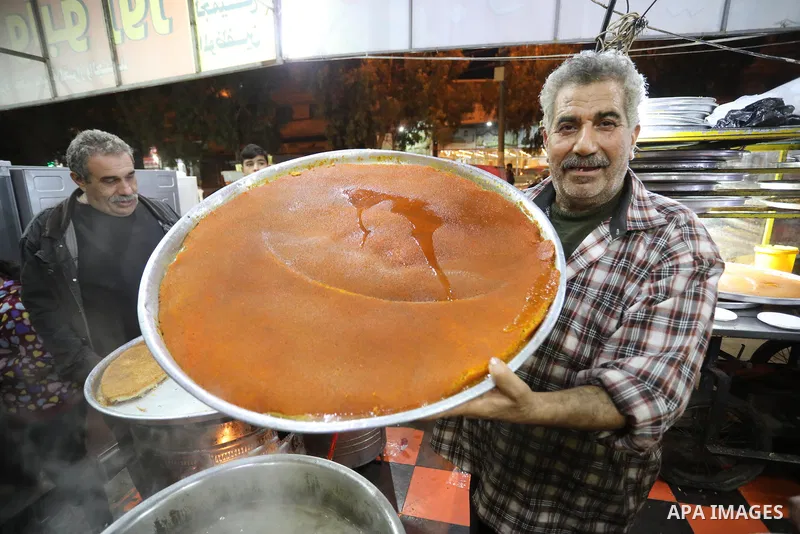 Masoud Al-Qatati, a Palestinian man sells sweets low prices and sometimes free for customers due to the difficult economic conditions of the residents of the Gaza Strip, in Gaza city on November 23, 2021. Al-Qatati said...