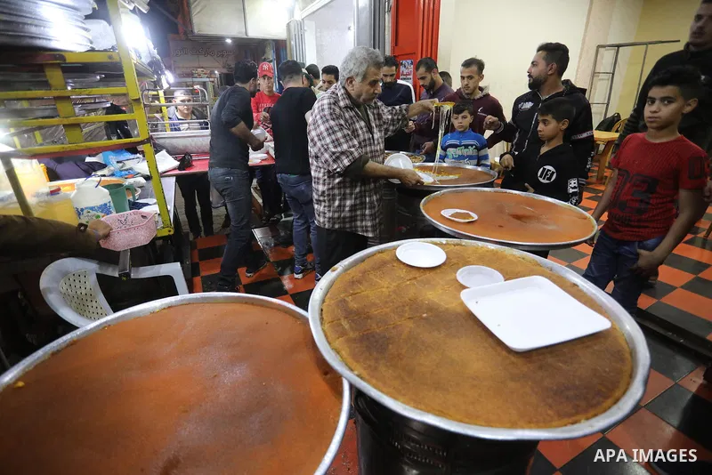 Masoud Al-Qatati, a Palestinian man sells sweets low prices and sometimes free for customers due to the difficult economic conditions of the residents of the Gaza Strip, in Gaza city on November 23, 2021. Al-Qatati said...
