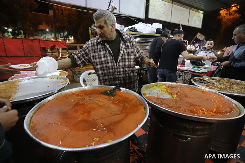 Masoud Al-Qatati, a Palestinian man sells sweets low prices and sometimes free for customers due to the difficult economic conditions of the residents of the Gaza Strip, in Gaza city on November 23, 2021. Al-Qatati said...