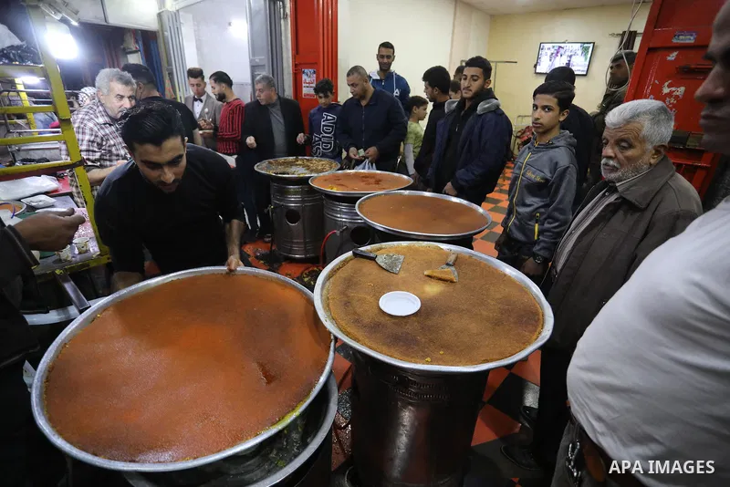 Masoud Al-Qatati, a Palestinian man sells sweets low prices and sometimes free for customers due to the difficult economic conditions of the residents of the Gaza Strip, in Gaza city on November 23, 2021. Al-Qatati said...