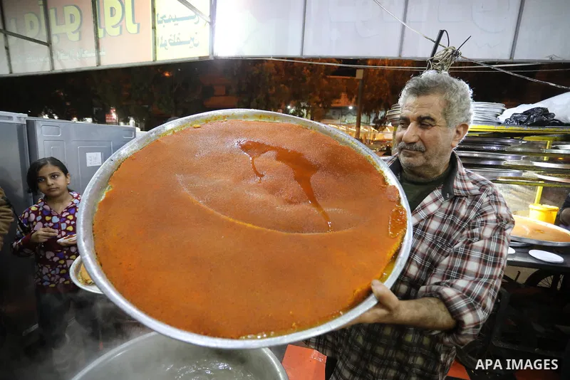 Masoud Al-Qatati, a Palestinian man sells sweets low prices and sometimes free for customers due to the difficult economic conditions of the residents of the Gaza Strip, in Gaza city on November 23, 2021. Al-Qatati said...