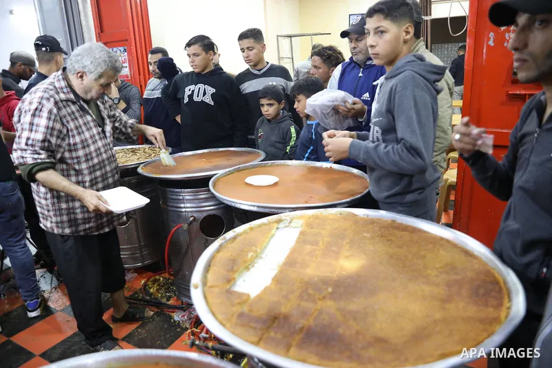 Masoud Al-Qatati, a Palestinian man sells sweets low prices and sometimes free for customers due to the difficult economic conditions of the residents of the Gaza Strip, in Gaza city on November 23, 2021. Al-Qatati said...