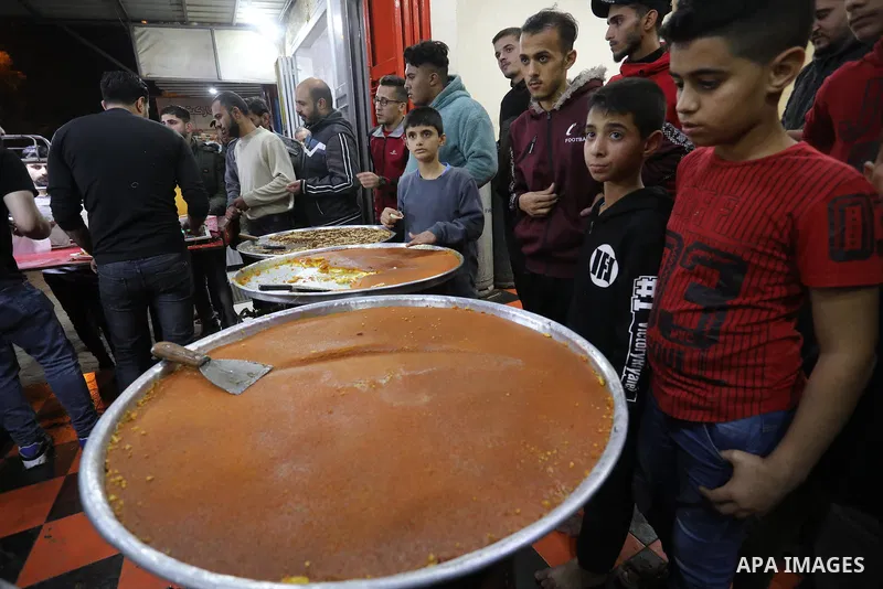 Masoud Al-Qatati, a Palestinian man sells sweets low prices and sometimes free for customers due to the difficult economic conditions of the residents of the Gaza Strip, in Gaza city on November 23, 2021. Al-Qatati said...
