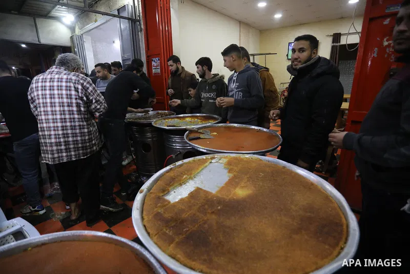 Masoud Al-Qatati, a Palestinian man sells sweets low prices and sometimes free for customers due to the difficult economic conditions of the residents of the Gaza Strip, in Gaza city on November 23, 2021. Al-Qatati said...