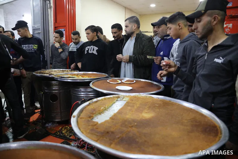 Masoud Al-Qatati, a Palestinian man sells sweets low prices and sometimes free for customers due to the difficult economic conditions of the residents of the Gaza Strip, in Gaza city on November 23, 2021. Al-Qatati said...