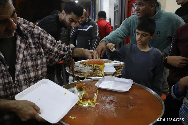 Masoud Al-Qatati, a Palestinian man sells sweets low prices and sometimes free for customers due to the difficult economic conditions of the residents of the Gaza Strip, in Gaza city on November 23, 2021. Al-Qatati said...