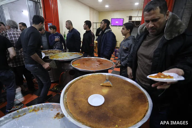 Masoud Al-Qatati, a Palestinian man sells sweets low prices and sometimes free for customers due to the difficult economic conditions of the residents of the Gaza Strip, in Gaza city on November 23, 2021. Al-Qatati said...
