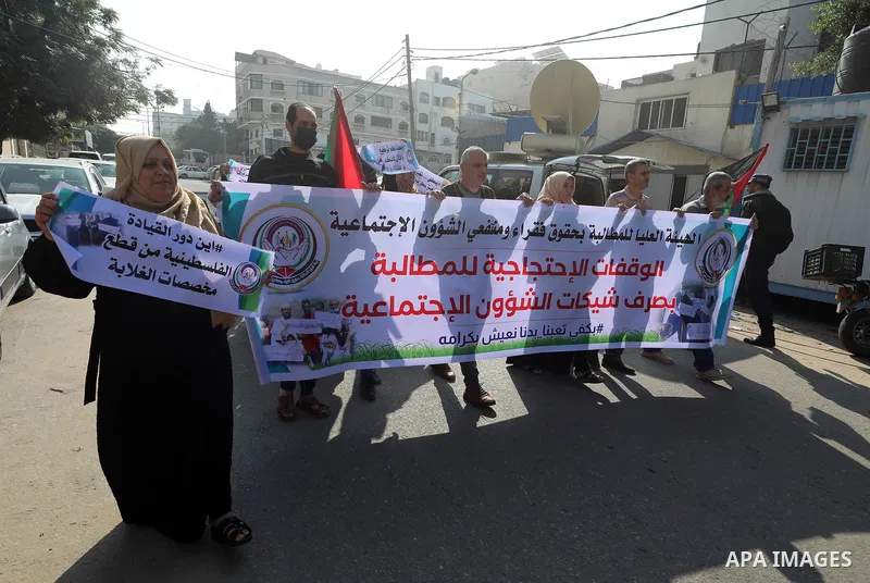 Palestinians of Social Affairs take part in a protest to demand the payment of their allowances, in front of United Nations Development Programme office (UNDP) in Gaza city November 24, 2021. Head of EU’s media office in...