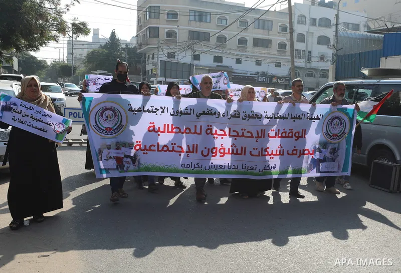 Palestinians of Social Affairs take part in a protest to demand the payment of their allowances, in front of United Nations Development Programme office (UNDP) in Gaza city November 24, 2021. Head of EU’s media office in...