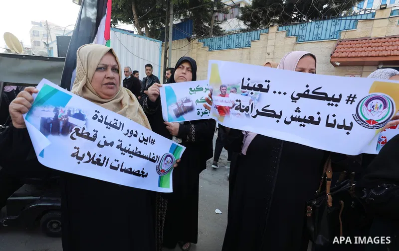 Palestinians of Social Affairs take part in a protest to demand the payment of their allowances, in front of United Nations Development Programme office (UNDP) in Gaza city November 24, 2021. Head of EU’s media office in...