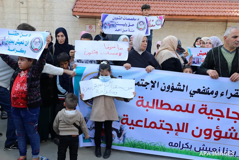 Palestinians of Social Affairs take part in a protest to demand the payment of their allowances, in front of United Nations Development Programme office (UNDP) in Gaza city November 24, 2021. Head of EU’s media office in...