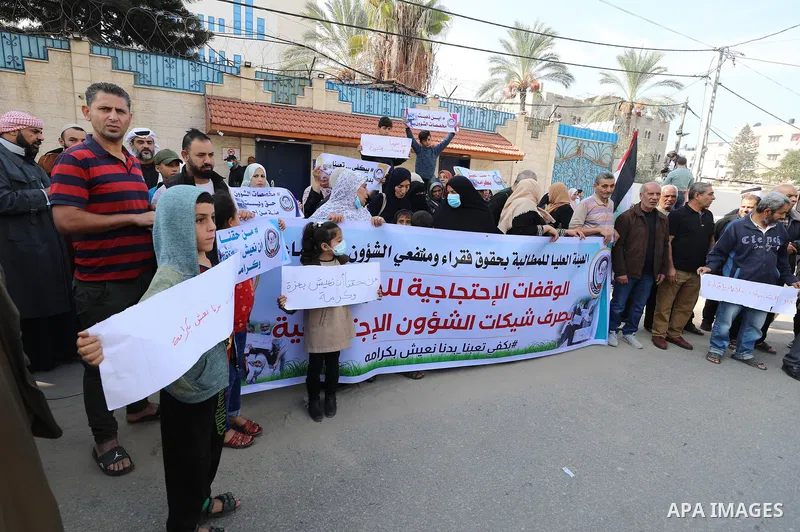 Palestinians of Social Affairs take part in a protest to demand the payment of their allowances, in front of United Nations Development Programme office (UNDP) in Gaza city November 24, 2021. Head of EU’s media office in...