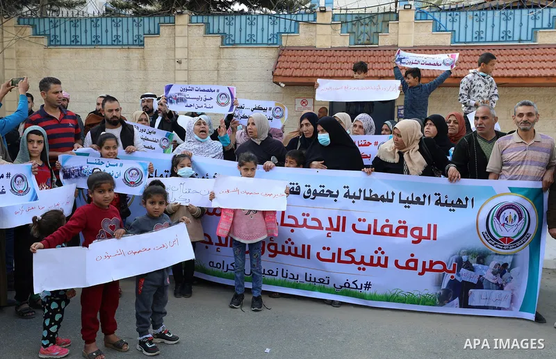 Palestinians of Social Affairs take part in a protest to demand the payment of their allowances, in front of United Nations Development Programme office (UNDP) in Gaza city November 24, 2021. Head of EU’s media office in...
