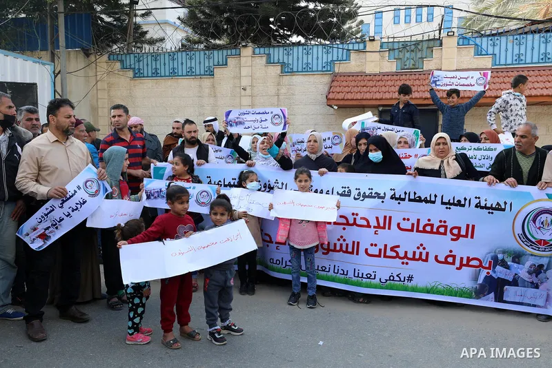 Palestinians of Social Affairs take part in a protest to demand the payment of their allowances, in front of United Nations Development Programme office (UNDP) in Gaza city November 24, 2021. Head of EU’s media office in...