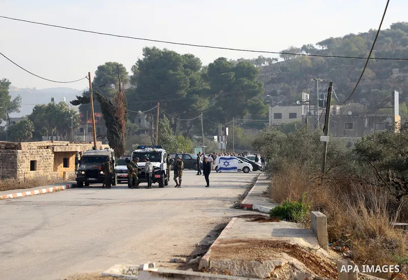 Israeli forces and Palestinian demonstrators clash in the village of al-Lubban al-Sharqiya in the Israeli-occupied West Bank on November 25, 2021. Photo by Wajed Nobani